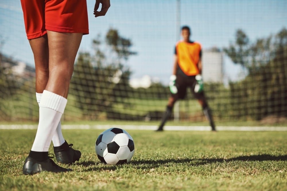 A soccer goalie prepares to save a penalty kick, just like a Medicare SEP can save you from late enrollment penalties.
